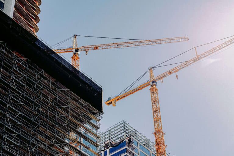Crane being used with buildings being built around
